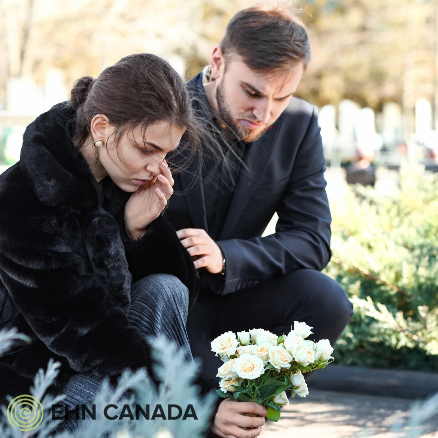Life expectancy in Canada declining. Grieving couple at friend's funeral.