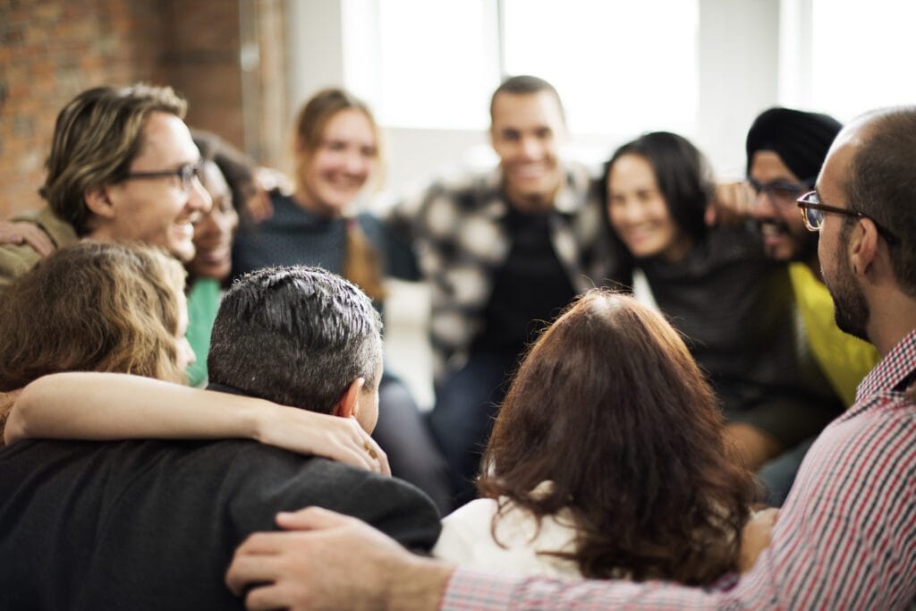 People with joined hands as a team