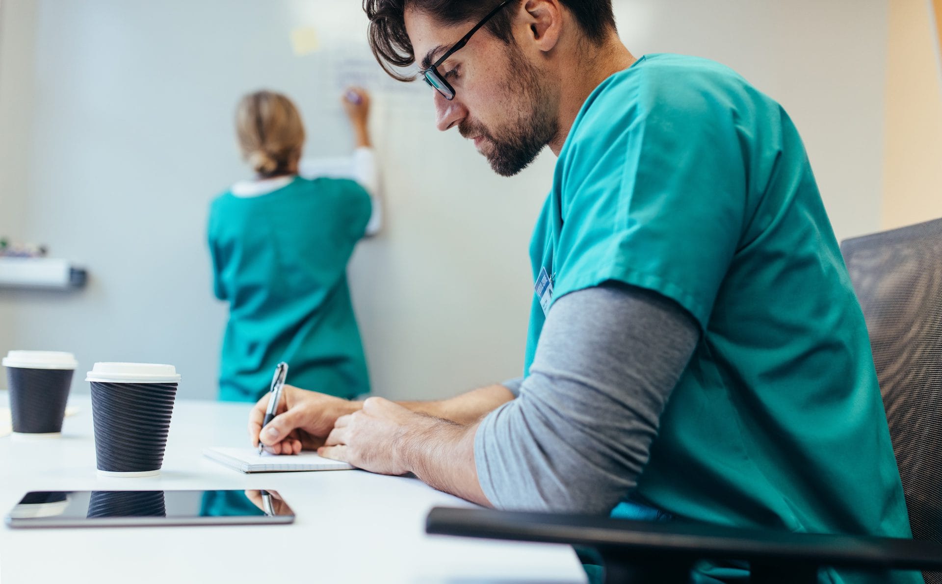 Healthcare worker working in hospital boardroom