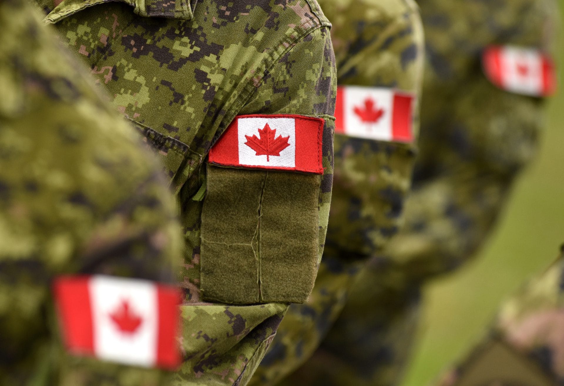 Canada patch flags on soldiers arm. Canadian troops