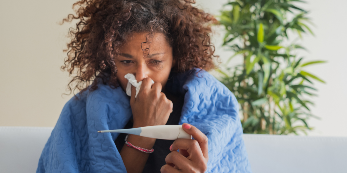 Woman wiping her nose sad