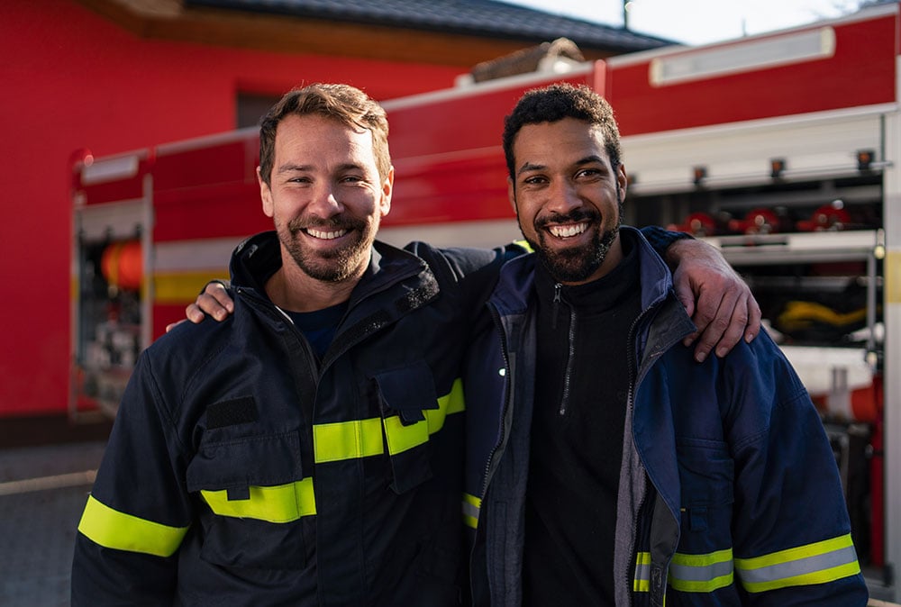 Two firefighters smiling - mental health and addiction