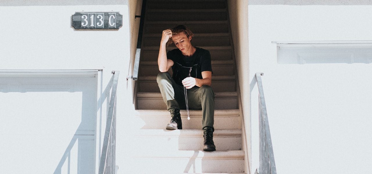 man sitting and contemplating hard about his oxycodone addiction