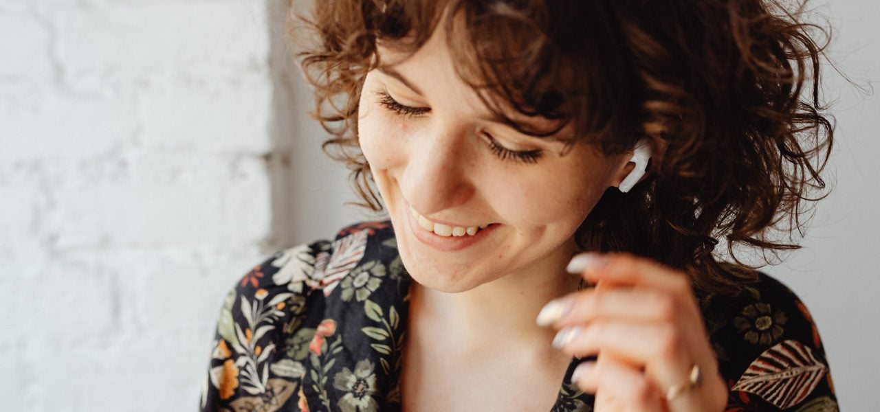 Woman happy listening to music but secretly suffering from eating disorder