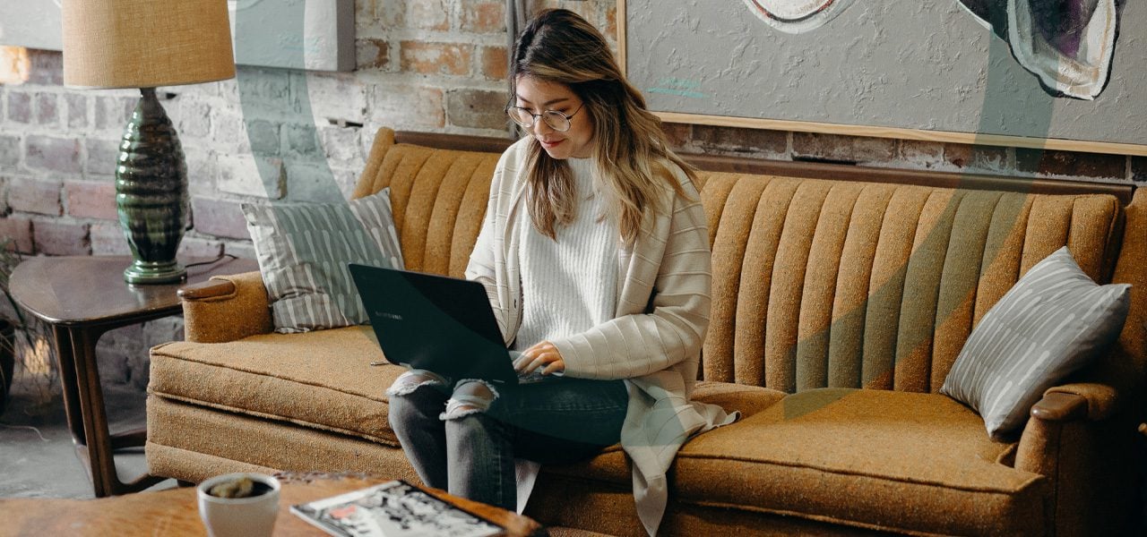 Woman browsing on laptop about alcohol addiction